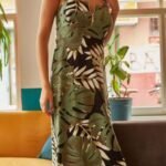 Women's dress with large palm pattern with green zipper